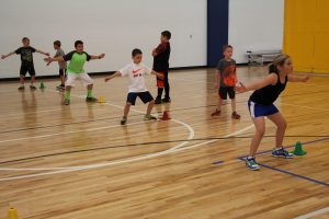 Young Boys and Girls Running Basketball Drills at The HUB Recreation Center