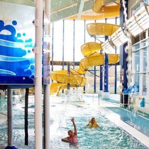 Swimming Boy Waterslide and Lazy River at The HUB Recreation Center in Marion Illinois