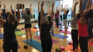 Dozens of Women Stretching Yoga Pose at The HUB Recreation Center