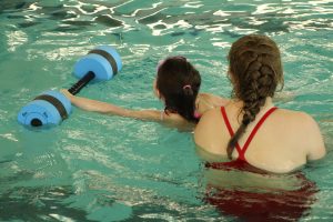 Young Girl and Swim Instructor at The HUB Recreation Center in Marion Illinois