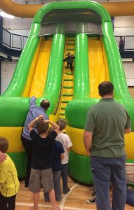 Small Boy Going Up Inflatable Slide at The HUB Recreation Center in Marion Illinois