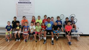 Small kids and tennis instructor The HUB Recreation Center