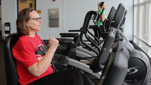 Woman on Exercise Bike at Fitness Center